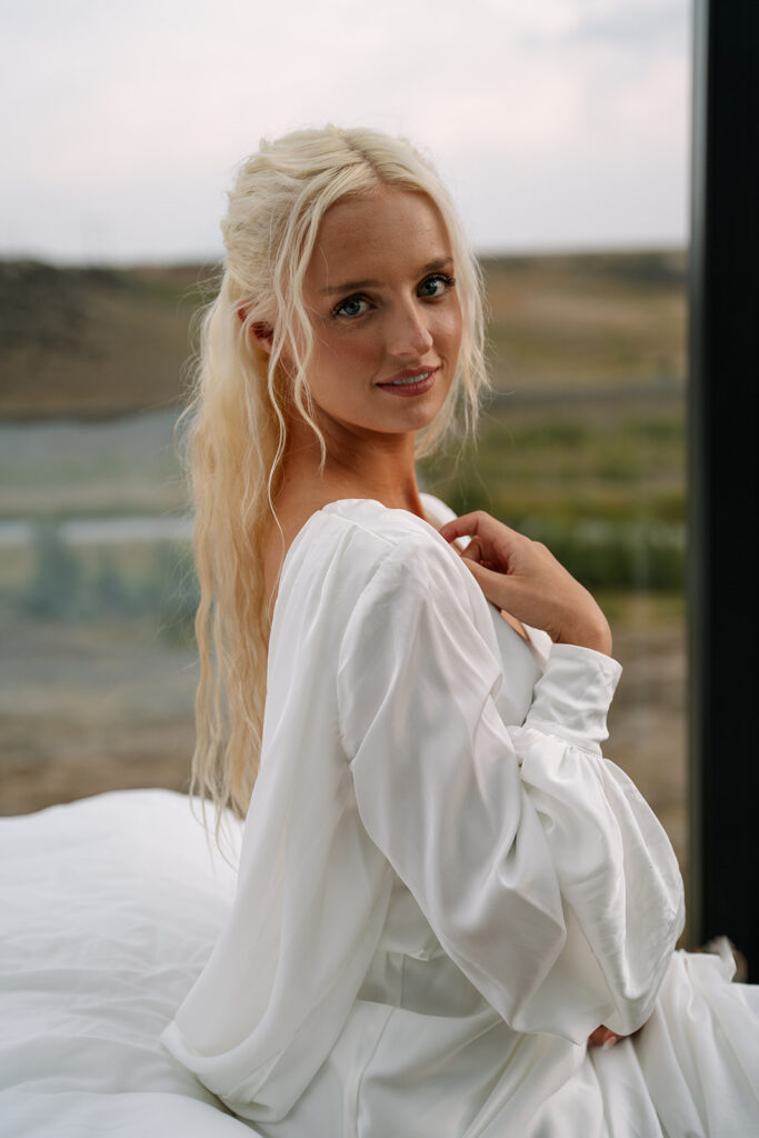bride getting ready in her Iceland window lodge