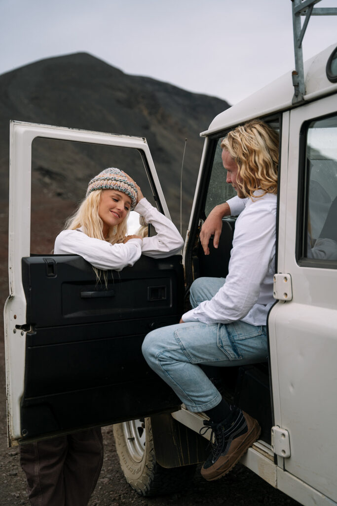 bride leaning into the window of the Range Rover in iceland