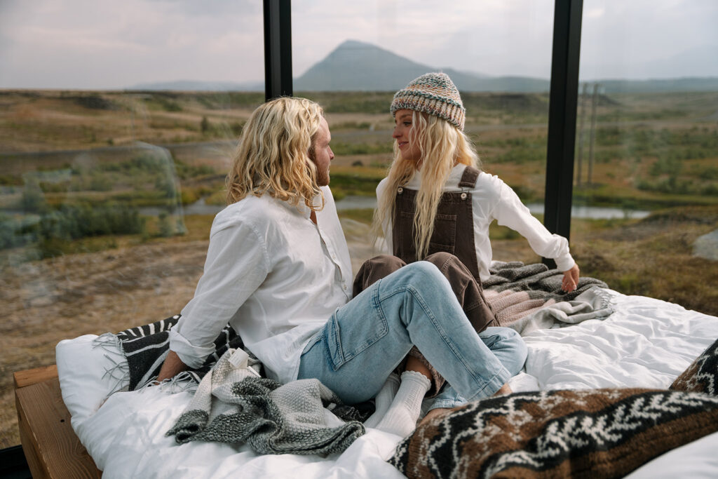 Newlyweds enjoying a relaxed morning at their glass lodge in Iceland