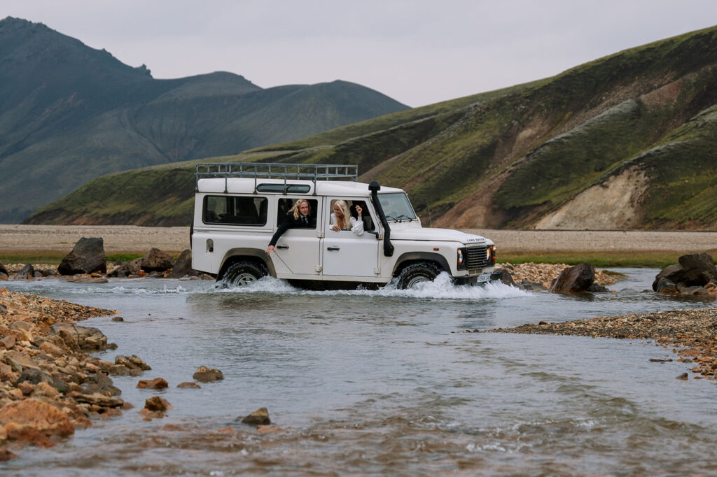 River crossing in a 4x4 Land Rover on the way to their Iceland elopement ceremony