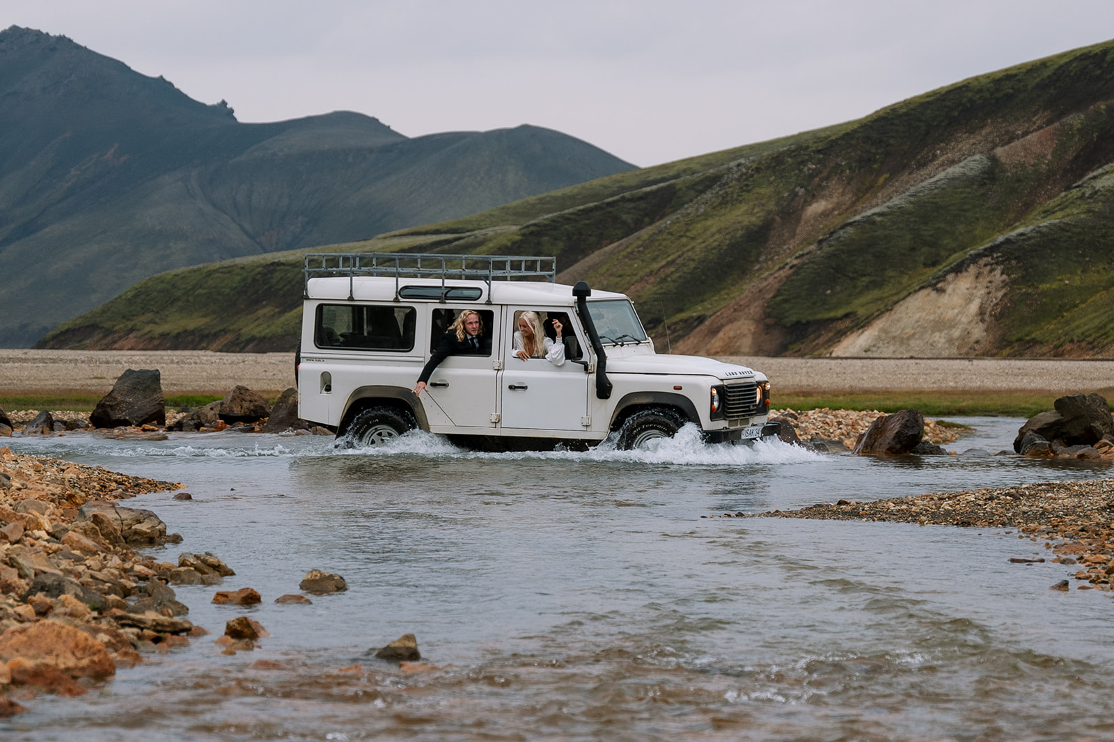 River crossing in a 4x4 Land Rover on the way to their Iceland elopement ceremony