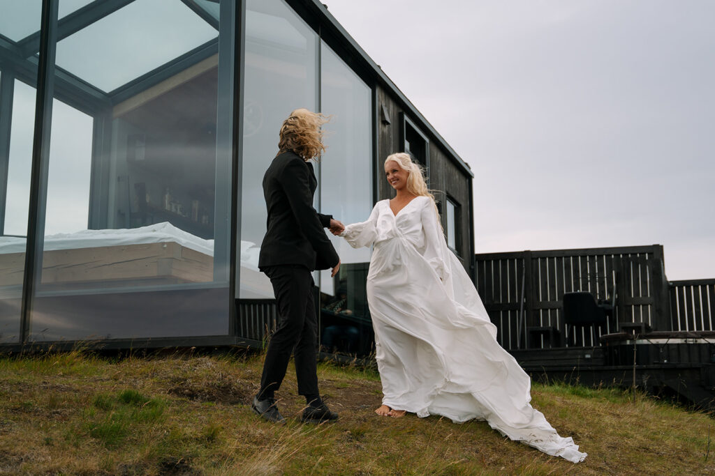 First look moment by the window at Panorama Glass Lodge