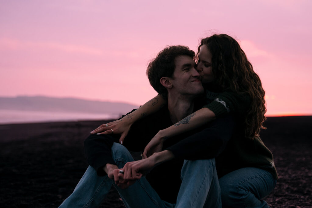 Sunset newlywed portraits during their Icelandic wedding celebration.