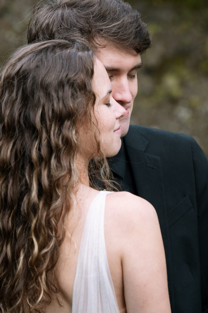 close up of a happy bride and groom at iceland waterfalls
