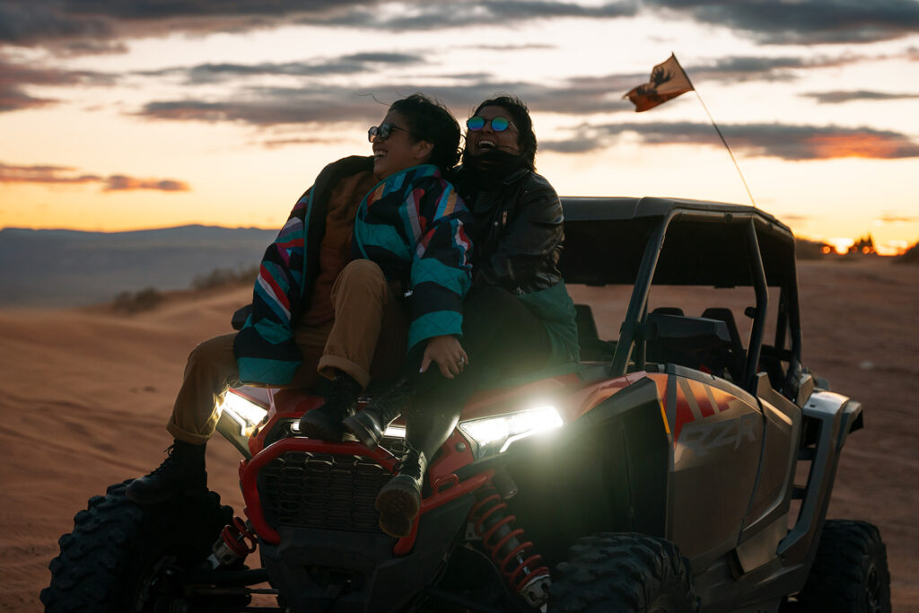 Adventurous elopement at sunset in Utah dunes captured by LGBTQ+ elopement photographer.