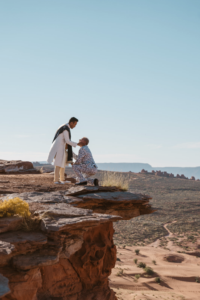 Emotional desert proposal photographed by a Utah-based LGBTQ+ elopement photographer.